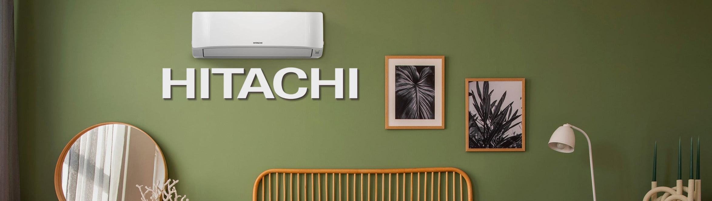 Hitachi air conditioner mounted on a green wall with decorative elements.