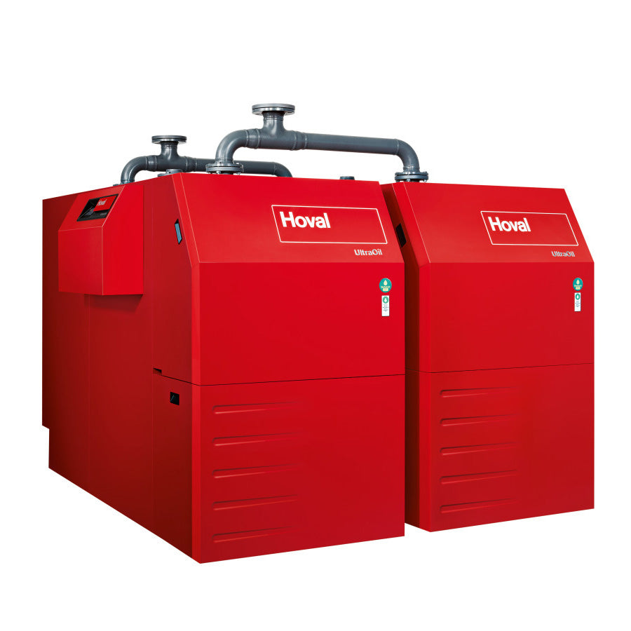 Two red Hoval industrial boilers connected by metal pipes on the top set on a white background