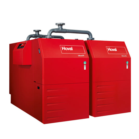 Two red Hoval industrial boilers connected by metal pipes on the top set on a white background
