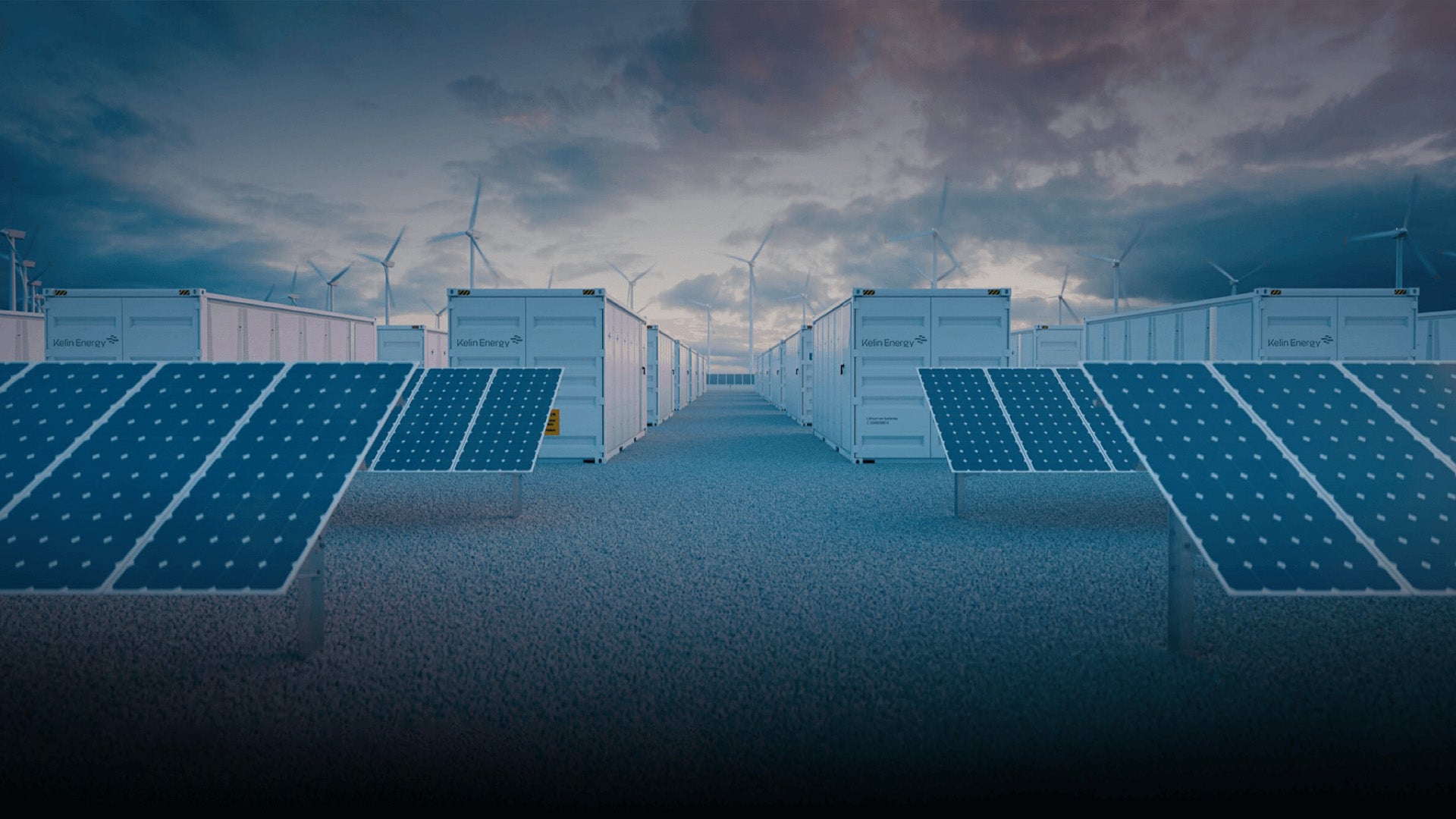 Solar panels with wind turbines in the background under a cloudy sky